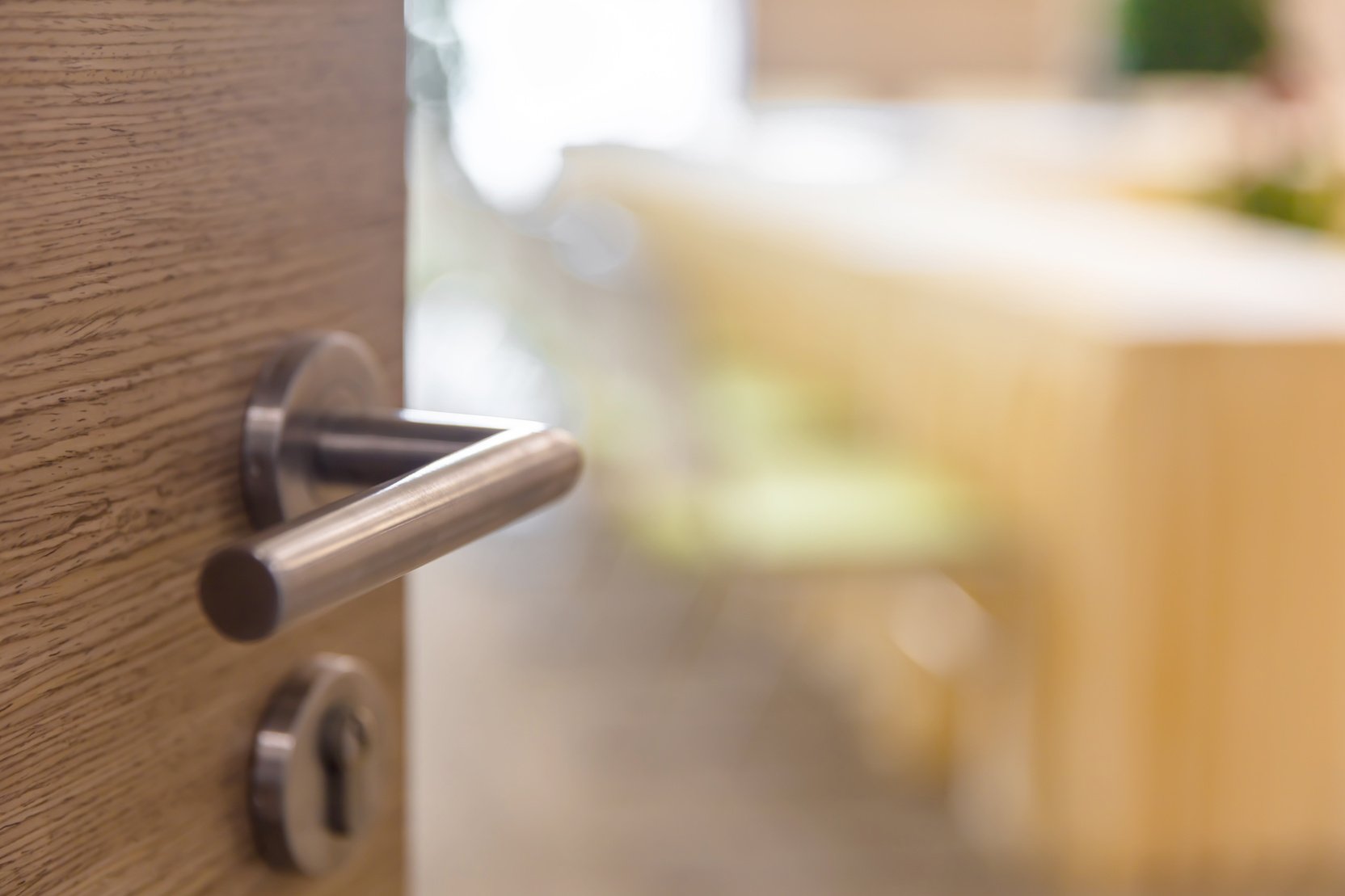 Open wooden door of conference room, selective focus